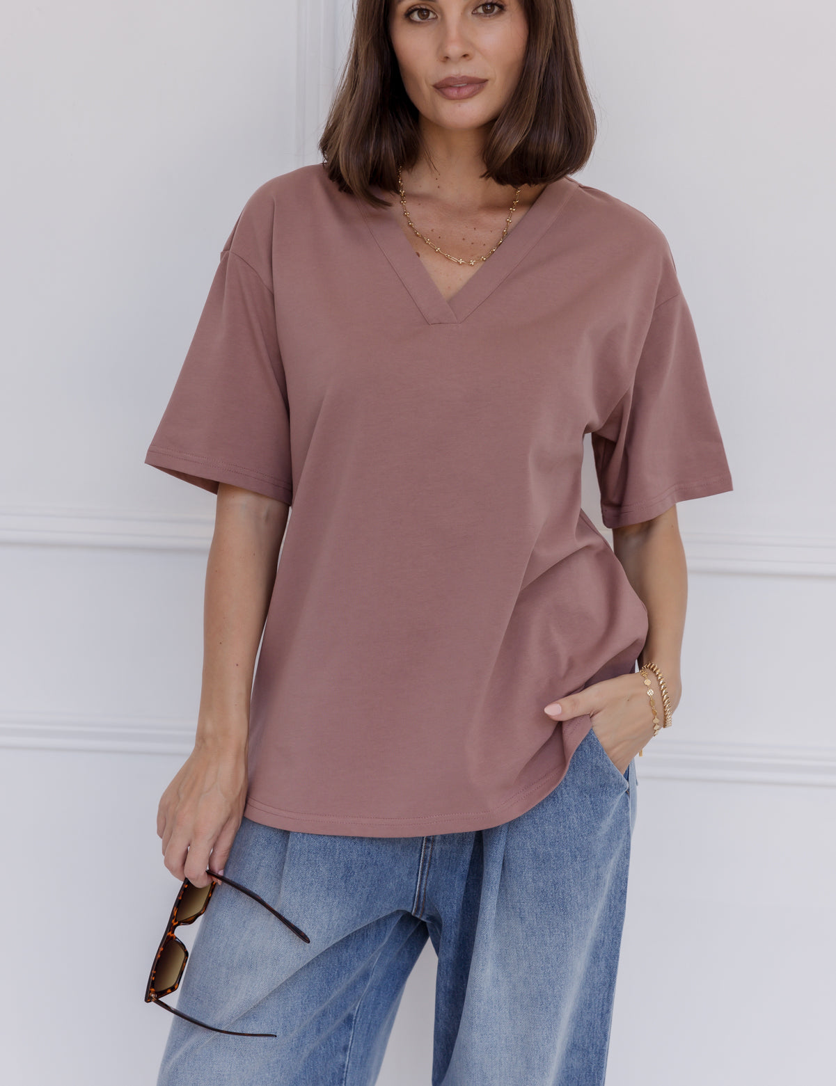 Woman wearing the NIX V-Neck T-Shirt in Mahogany by ALEXANDRA