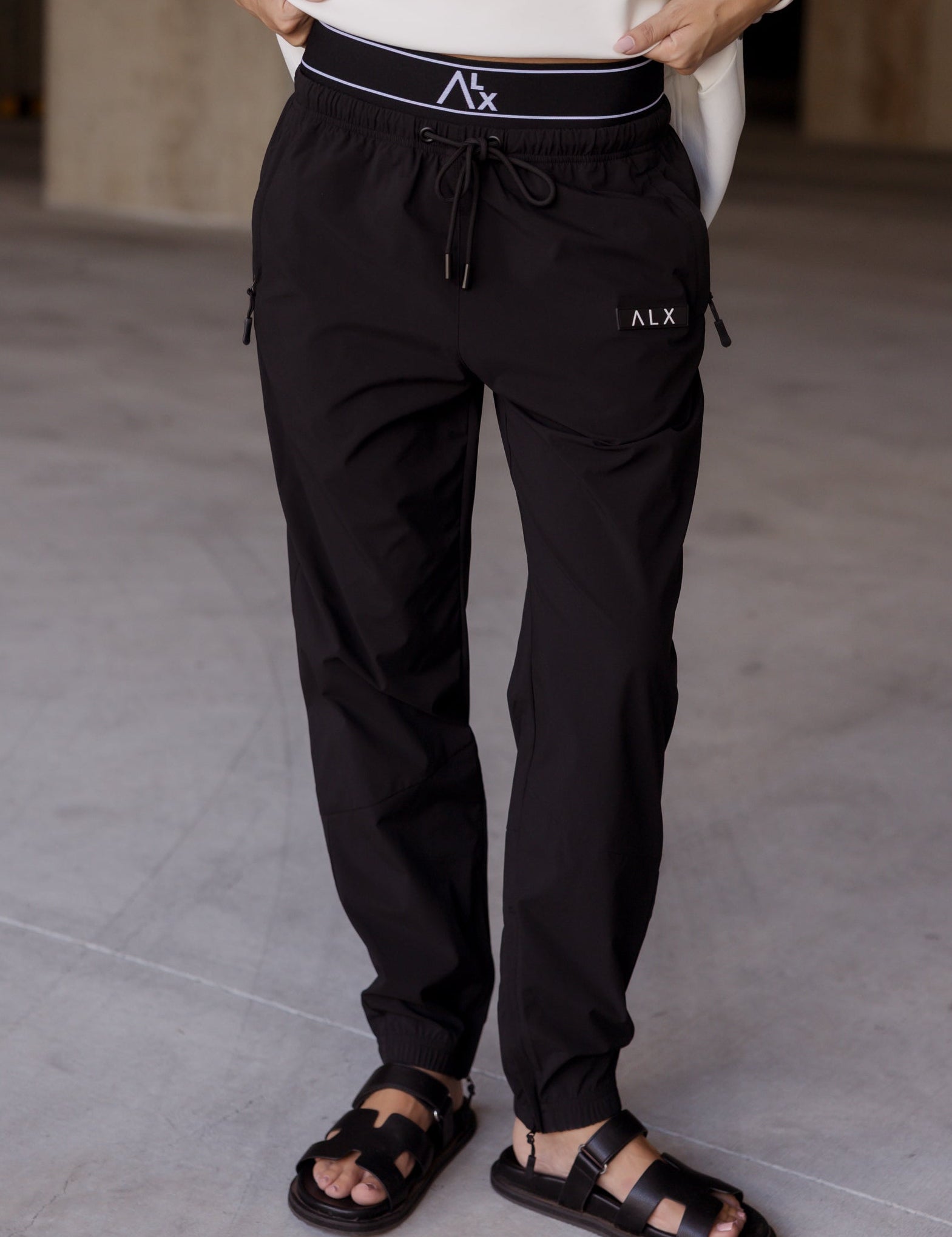Woman wearing LUCIEN Joggers in Black by ALEXANDRA