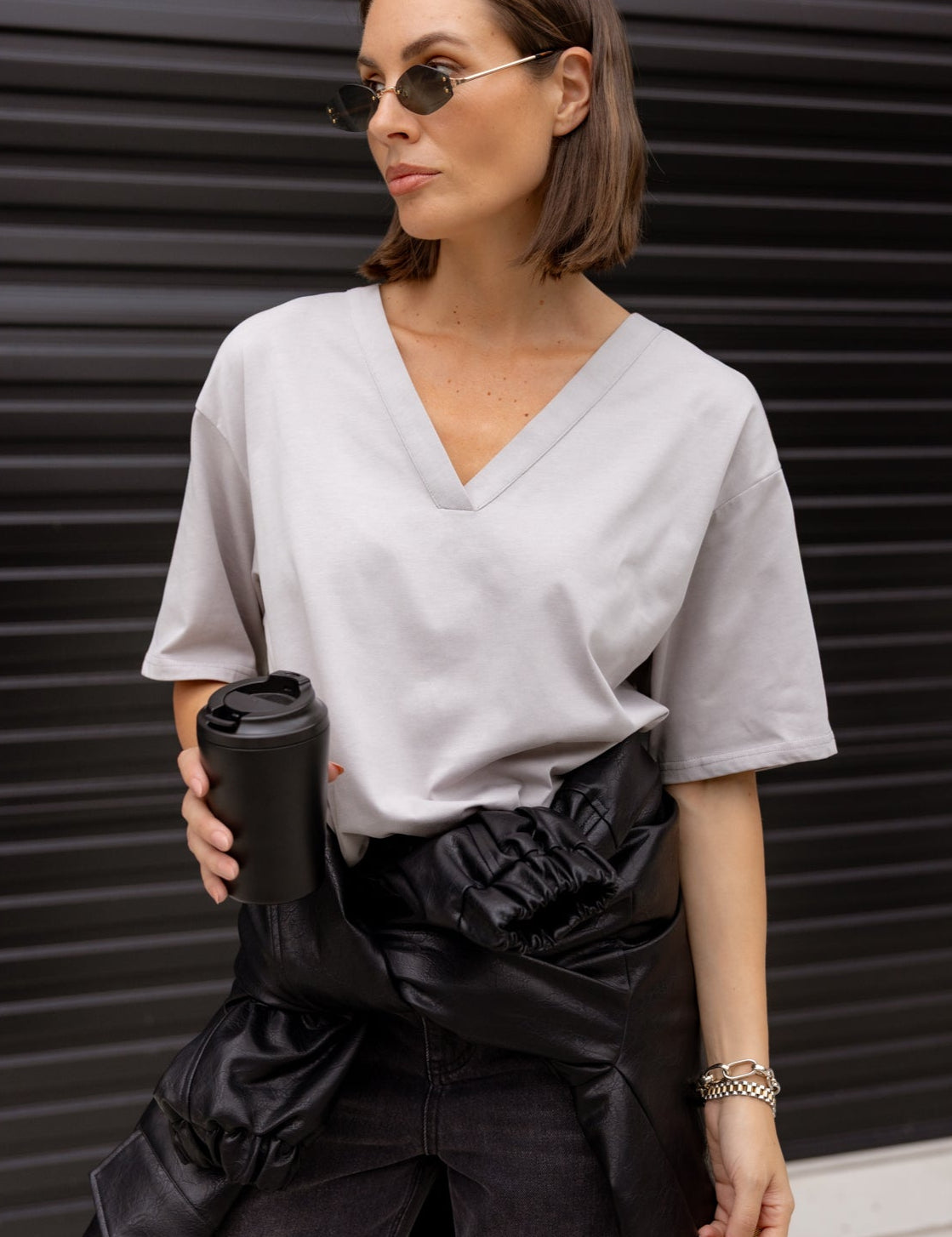 Woman wearing the NIX V-Neck T-Shirt in Grey by ALEXANDRA